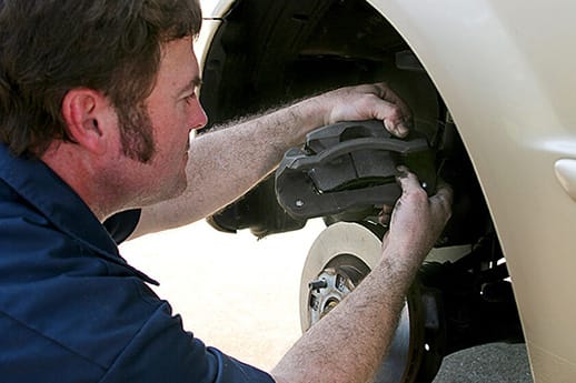 mobile-mechanic-brake-repair-chula-vista Mechanic Inserting Brake Pad